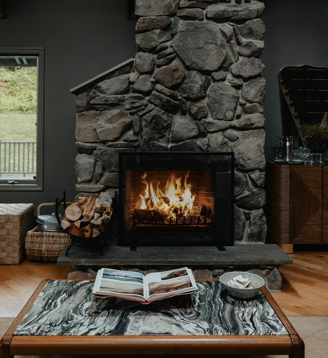 A crackling fire in a stone fireplace