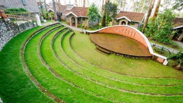 Terraced lawn amphitheatre surrounded by cottages