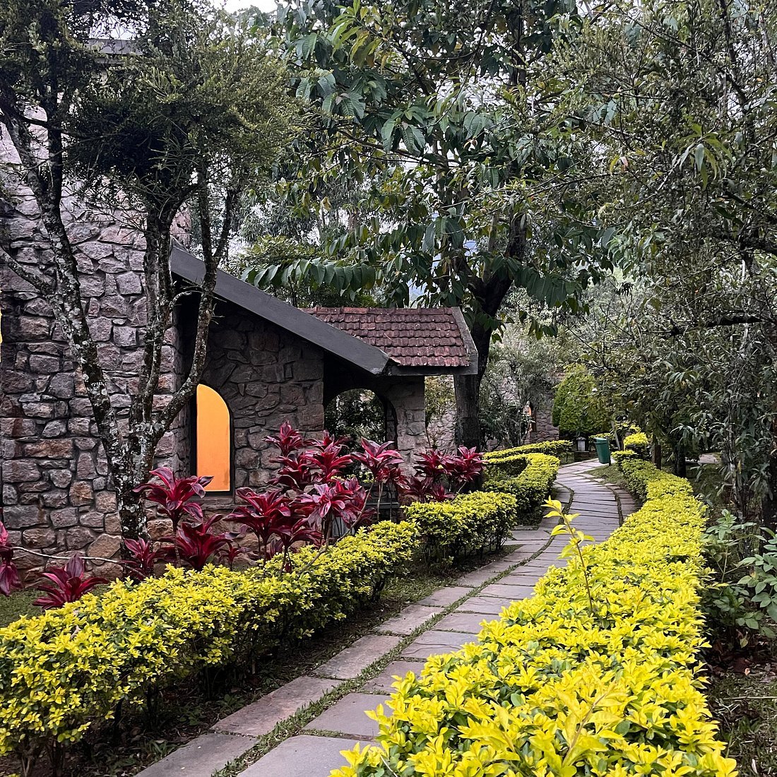 Garden pathway leading to a stone cottage