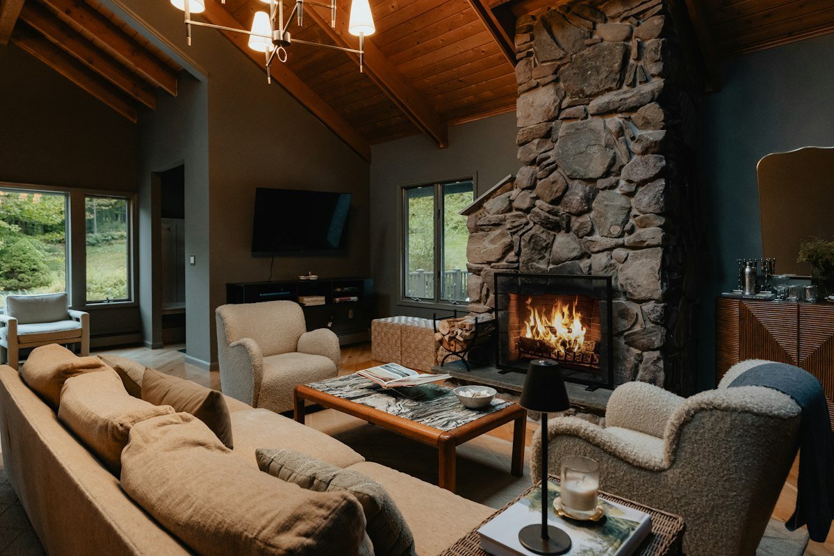 Living room with a stone fireplace