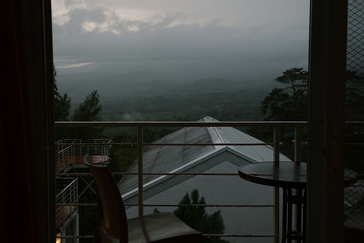 Private balcony overlooking a misty valley