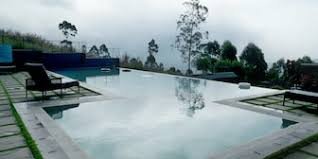 Misty infinity pool overlooking the hills